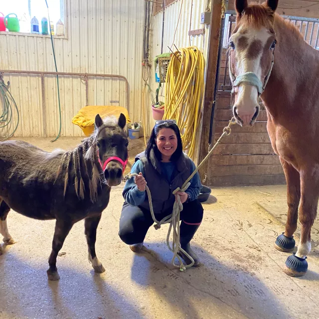 Melissa with her horse and her mini